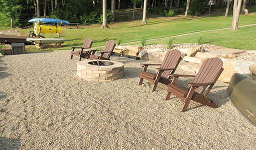 Lake front fire pit with new lawn installation